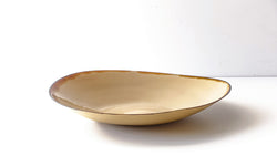 amorphous oval slip cast porcelain plate